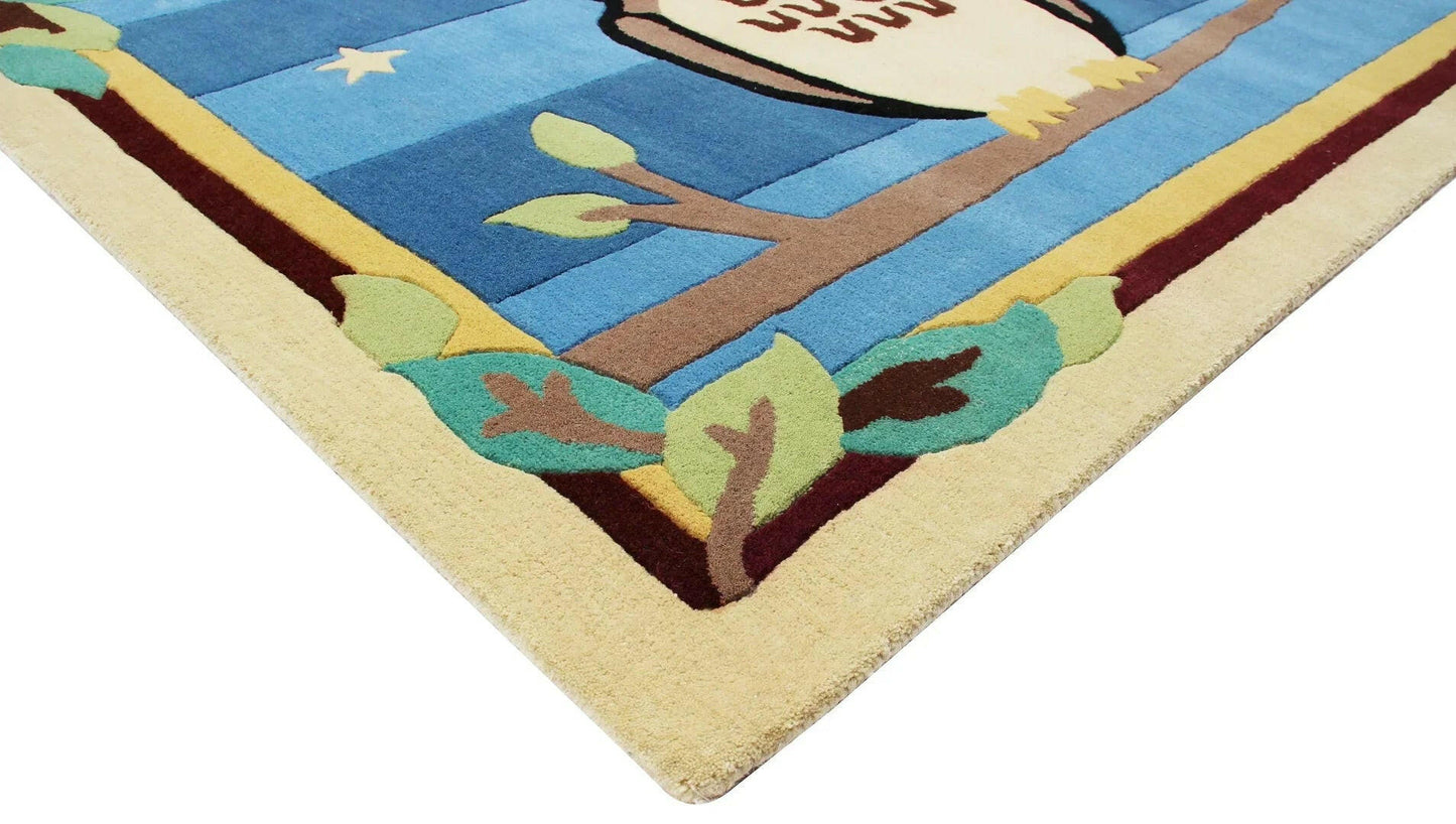 Cozy Comfort Blue Hand-Tufted Kids' Owl Rug for Nursery or Playroom.