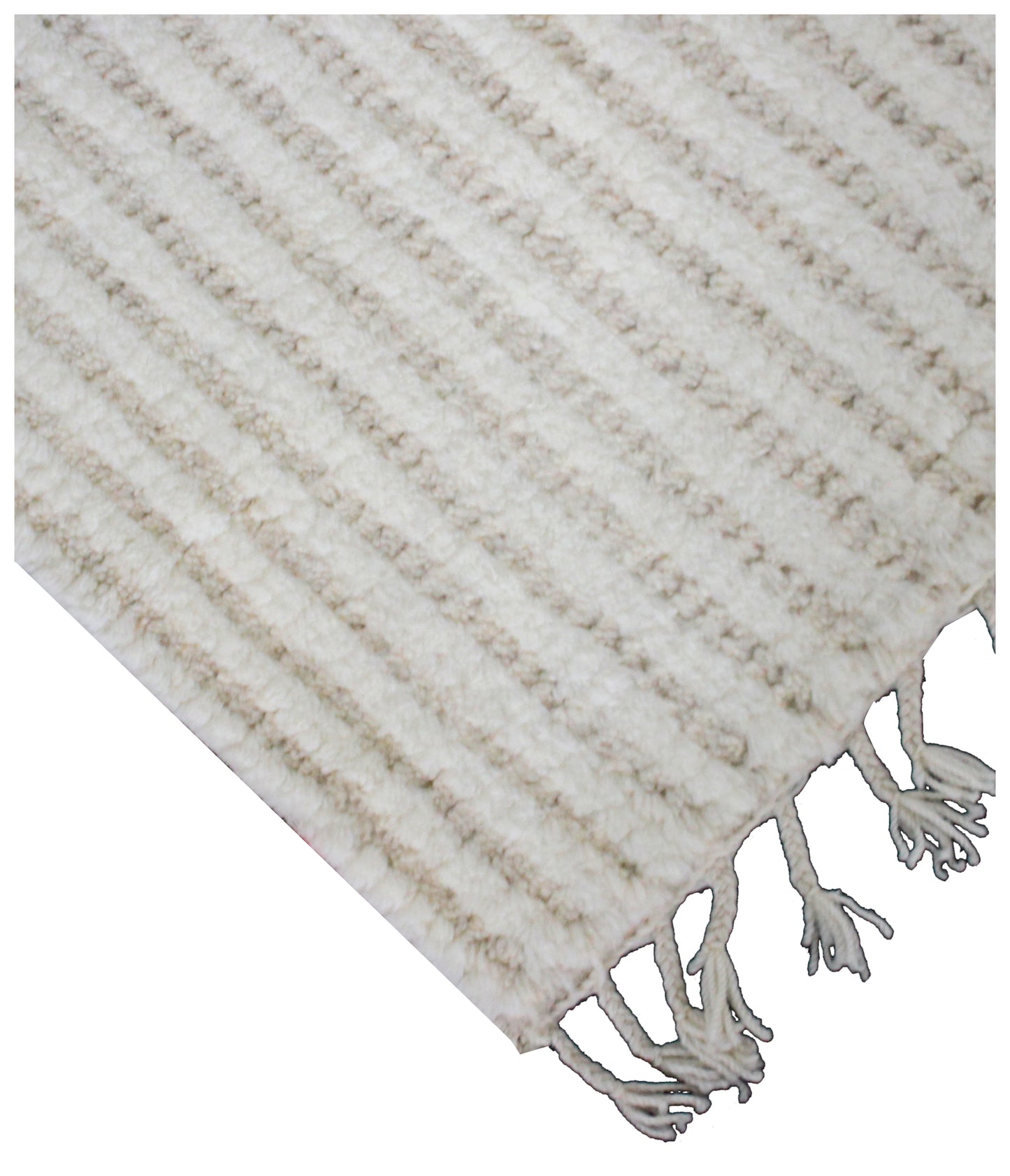 Textured beige and white rug with tassels on a plain background