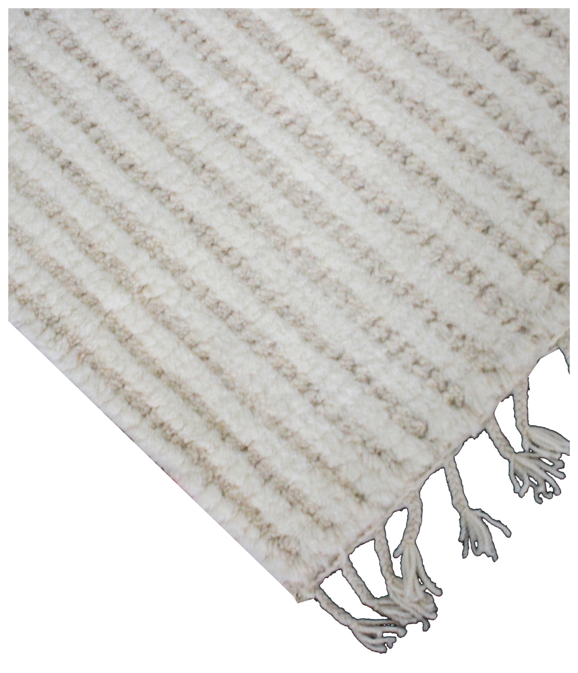 Textured beige and white rug with tassels on a plain background