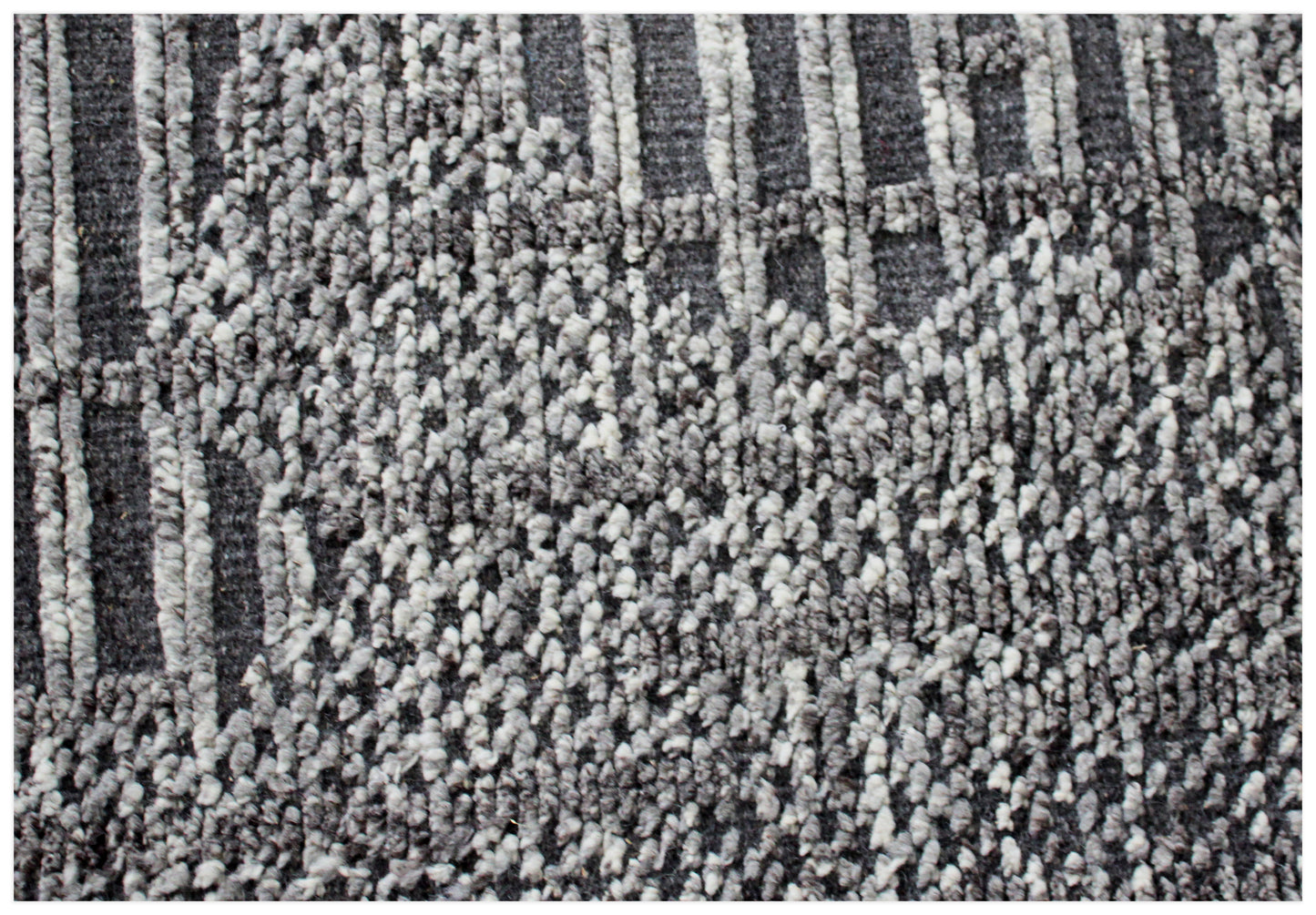 Close-up of textured gray and black carpet