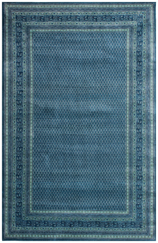 Blue area rug with intricate border design